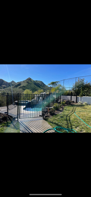 black metal fence with pool view