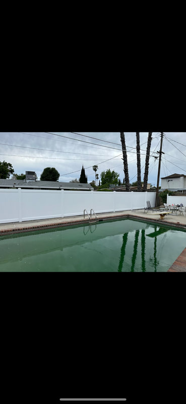 white fence with pool